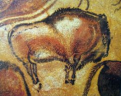 cave painting of bison, and early form of sympathetic magic that put animals under control by capturing their image